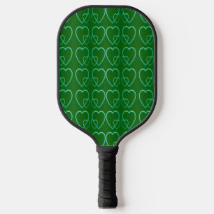 Teal hearts on green pickleball paddle