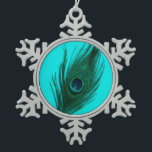 Teal Peacock Feather Snowflake Pewter Christmas Ornament<br><div class="desc">A peacock feather with the teal tones brought out on a teal background.</div>