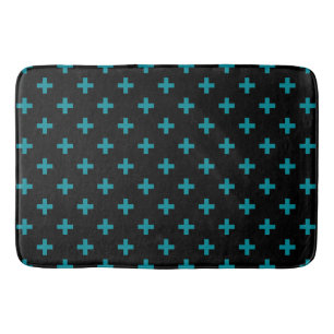 Teal polka crosses on black bath mat