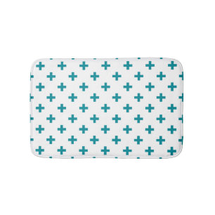Teal polka crosses on white bath mat