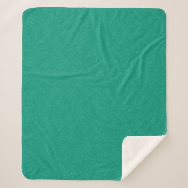 Teal textured surface with subtle swirling pattern sherpa blanket (Front)