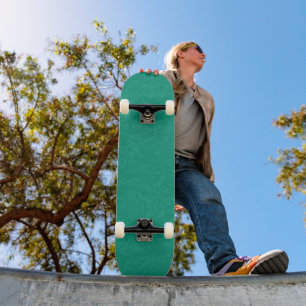 Teal textured surface with subtle swirling pattern skateboard