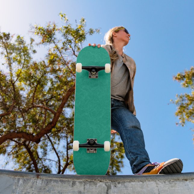 Teal textured surface with subtle swirling pattern skateboard (Outdoor 1)