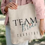 Team Bride | Bridesmaid | Wedding Tote Bag<br><div class="desc">Team Bride | Bridesmaid | Wedding Tote Bag .Personalised bridesmaid tote bags are a thoughtful and practical way to show your appreciation for your bridesmaids. They're also a great way to add a personal touch to your wedding day. Zazzle offers a wide variety of personalised bridesmaid tote bags to choose...</div>