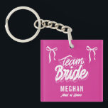 Team Bride Coquette Bow Bridesmaid Gift Key Ring<br><div class="desc">Show your appreciation with our Team Bride Coquette Bow Bridesmaid Gift Keychain! Featuring a dainty bow design and a touch of feminine charm, this elegant keychain is the perfect token of gratitude for your bridal party. Stylish and practical, it’s a keepsake your bridesmaids can carry with them every day, reminding...</div>