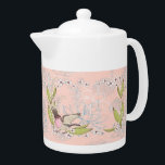 Teapot with Pink Floral & Bird Design<br><div class="desc">Teapot with a pretty light pink floral and bird design.  The flowers are white,  the bird is pink with wings open and there are pretty green leaves.  Thanks to Creative Fabrica,  and the Hungryjpeg for some of the elements in the design.</div>