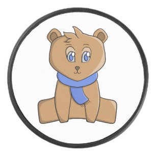 Teddy bear wearing a blue scarf hockey puck