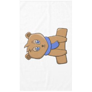 Teddy bear wearing a blue scarf tablecloth