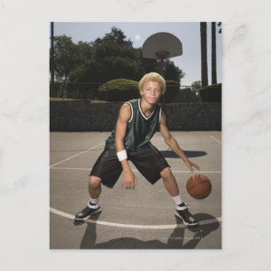 Teenage boy on basketball court postcard