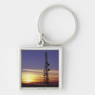 Telecommunications mast at sunset key ring