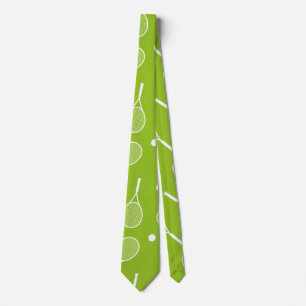 Tennis ball and racket on green tie