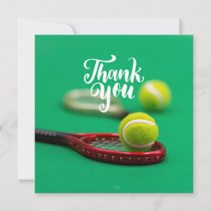 Tennis ball and red racket on green Thank you
