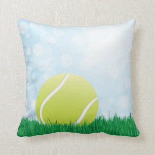 tennis ball on grass cushion