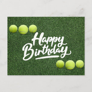 Tennis balls are on green grass birthday postcard