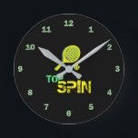 Tennis Sport Pop Art, Green & Yellow Racket & Ball Round Clock<br><div class="desc">Retro,  pop,  colourful creation of Tennis Racket silhouette,  Round Clock.
Special theme of Green & Yellow colouring,  with simple but elegant icon styled art.
Original digital art by Raphael Studio - 'Tennis'.
Retro pop & style,  unique design.</div>
