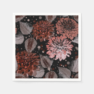 Terracotta flowers with grey leaves on a black napkin