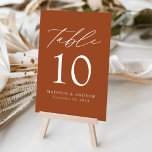 Terracotta Modern Elegance Wedding Table Number<br><div class="desc">Trendy, minimalist wedding table number cards featuring white modern lettering with "Table" in a modern calligraphy script. The design features a terracotta background or colour of your choice. The design repeats on the back. To order the table cards: add your name, wedding date, and table number. Add each number to...</div>