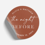 Terracotta Rehearsal Dinner | Night Before Fall Classic Round Sticker<br><div class="desc">Warm and earthy, this elegant terracotta round sticker featuring the phrase “The Night Before” is perfect for boho, rustic, or fall themed weddings. The rich clay orange background adds a cosy, modern touch to your rehearsal dinner decor. Use this versatile sticker to seal envelopes, decorate favour bags, or personalise welcome...</div>