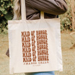 Terracotta Retro Boho Personalised Maid of Honour Tote Bag<br><div class="desc">Are you looking for the perfect gift for your maid of honour? Look no further than our personalised burnt orange tote bags! These totes are perfect for any wedding or bridal party occasion. Not only are they stylish, but they're also practical and can hold a lot of goodies. So why...</div>