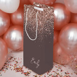 Terracotta Rose Gold Blush Pink Glitter Monogram Wine Gift Bag<br><div class="desc">Terracotta and Rose Gold - Blush Pink Sparkle Glitter Script Monogram Name Gift Bag. This makes the perfect sweet 16 birthday,  wedding,  bridal shower,  anniversary,  baby shower or bachelorette party gift bag for someone that loves glam luxury and chic styles.</div>