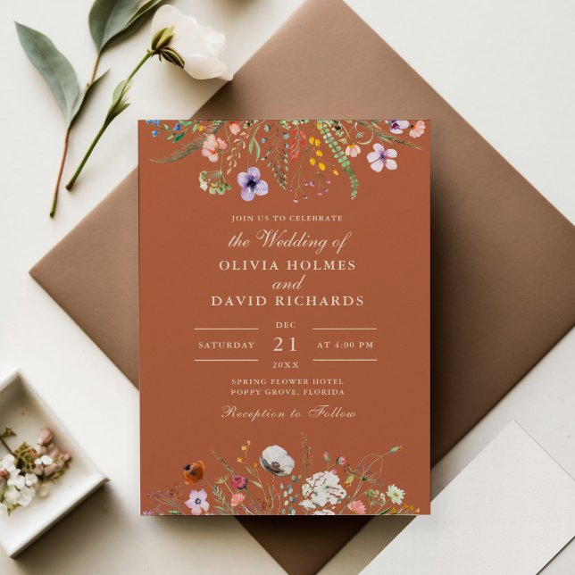 Terracotta Watercolor Wildflower Meadow Wedding Invitation (Terracotta Wildflower Meadow Wedding Invitation on wedding table with flowers.)