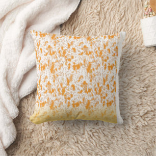 Textile pattern featuring a vibrant orange and gol cushion