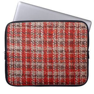 Texture of red tartan fabric useful as a backgroun laptop sleeve