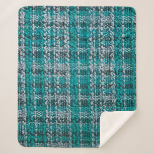 Texture of turquoise tartan fabric sherpa blanket