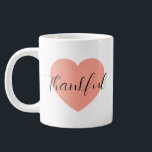 Thankful  large coffee mug<br><div class="desc">Start your day with gratitude and style with this “Thankful” mug! Featuring elegant black calligraphy over a soft pink heart, it’s perfect for coffee, tea, or any cosy drink. A simple, heartwarming way to bring positivity to your morning routine, this mug also makes a thoughtful gift for friends, family, or...</div>
