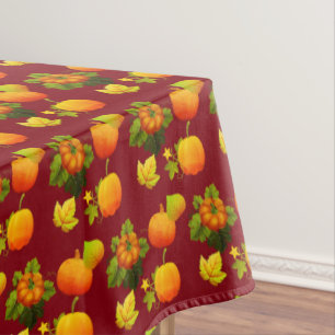 Thanksgiving Pumpkins & Fall Leaves on Maroon Tablecloth