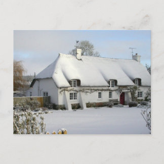 Thatched cottage in snow postcard