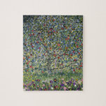 The Apple Tree (by Gustav Klimt) Jigsaw Puzzle<br><div class="desc">This design features artwork by Gustav Klimt (1862–1918), who was an Austrian symbolist painter and one of the most prominent members of the Vienna Secession movement. The painting featured in this design shows a beautiful apple tree bearing fruit, bright red apples hanging from its boughs. The image is painted with...</div>