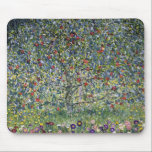 The Apple Tree (by Gustav Klimt) Mouse Pad<br><div class="desc">This design features artwork by Gustav Klimt (1862–1918), who was an Austrian symbolist painter and one of the most prominent members of the Vienna Secession movement. The painting featured in this design shows a beautiful apple tree bearing fruit, bright red apples hanging from its boughs. The image is painted with...</div>