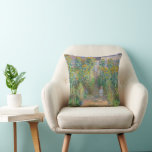 The Artist's Garden at Vétheuil by Claude Monet Cushion<br><div class="desc">The Artist's Garden at Vétheuil is painting by Claude Monet featuring a small child stands facing us on a sun-dappled path that runs up the centre of a garden dominated by towering yellow and burnt-orange sunflowers. Behind the child, a woman and another child stand on the steps. The woman wears...</div>