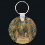The Artist's Garden at Vetheuil by Claude Monet Key Ring<br><div class="desc">The Artist's Garden at Vetheuil (1880) by Claude Monet is a vintage impressionism fine art floral nature painting. A young girl is flanked by tall blooming yellow sunflower flowers during the summer season. A child is standing in a path in Monet's garden in Vetheuil (a suburb of Paris). About the...</div>