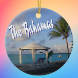 The Bahamas Commemorative Ceramic Tree Decoration<br><div class="desc">The Bahamas commemorative ornament to celebrate happy memories of your tropical Caribbean vacation. Photo of a lovely beach scene with a cabana and palm tree,  along with The Bahamas in fun typography. Choose your ornament shape.</div>