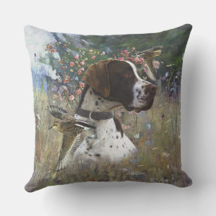 The beautiful pointer in the field cushion