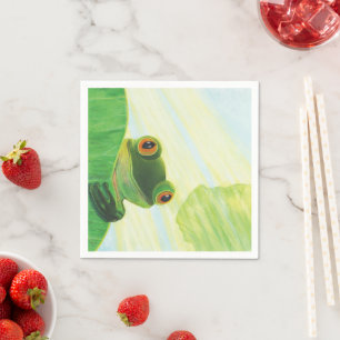 The big-eyed green frog behind lily pad napkin