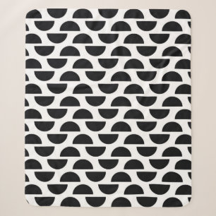 The black halves of the circle create a simple pat sherpa blanket