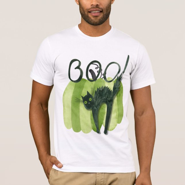 The boo! cat hiding in front of a green pumpkin.  T-Shirt (Front)