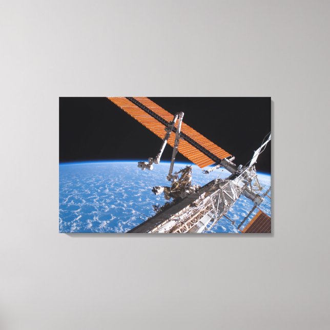 The Canadarm2 and solar array panel wings Canvas Print (Front)