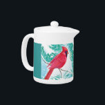 The Cardinal -<br><div class="desc">This design features a red cardinal sitting on a snow covered branch. The bird is watching the snowflakes falling from the sky and covering the ground. The trees around the bird are also snow covered. A green backround is used for this teapot.</div>