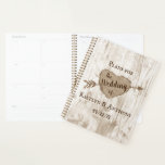 The Carved Heart Tree Wedding Collection Planner<br><div class="desc">Get ready for your big day in style with this rustic and very trendy wedding planner. The design is easy to personalise with your own names and wedding date and you can keep all your design ideas, important wedding information and much more safely together in this personalised planner. Matching wedding...</div>