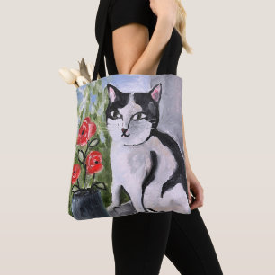 The cat and the poppies tote bag