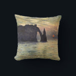 The Cliff Etretat, Sunset by Claude Monet Cushion<br><div class="desc">The Cliff, Etretat, Sunset (1883) by Claude Monet is a vintage impressionist fine art nautical painting. The sun is low in the sky over the ocean. A maritime seascape featuring a rocky outcrop near the shore at Etretat, France. About the artist: Claude Monet (1840-1926) was a founder of the French...</div>