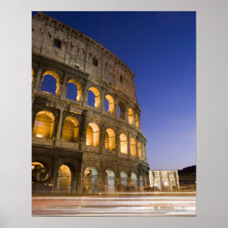 the Colosseum ampitheatre illuminated at night Poster