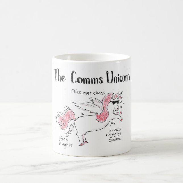 The comms unicorn coffee mug (Center)