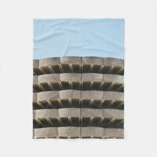The concrete exterior of a multi-story parking lot fleece blanket