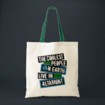 The Coolest People on Earth Live in Altamont Tote Bag<br><div class="desc">This design features bold, layered text with the phrase "The Coolest People on Earth Live in Altamont" in a striking cool color palette. A globe graphic, integrated with coordinating blue and green blocks, symbolizes the city's global appeal. The design is suitable for showcasing local pride, as it boldly declares Altamont's...</div>
