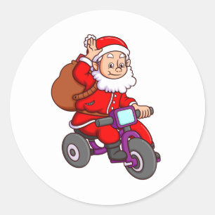 the cute santa claus is riding the bicycle and wav classic round sticker